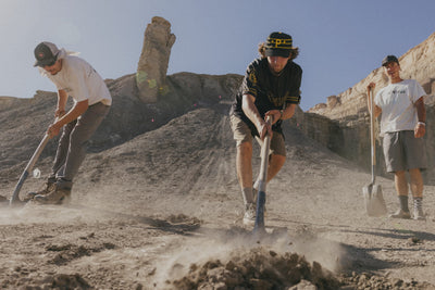 A looping collection of images featuring models out in the desert wearing 686 Unwork shorts and pants on a mountain bike track.